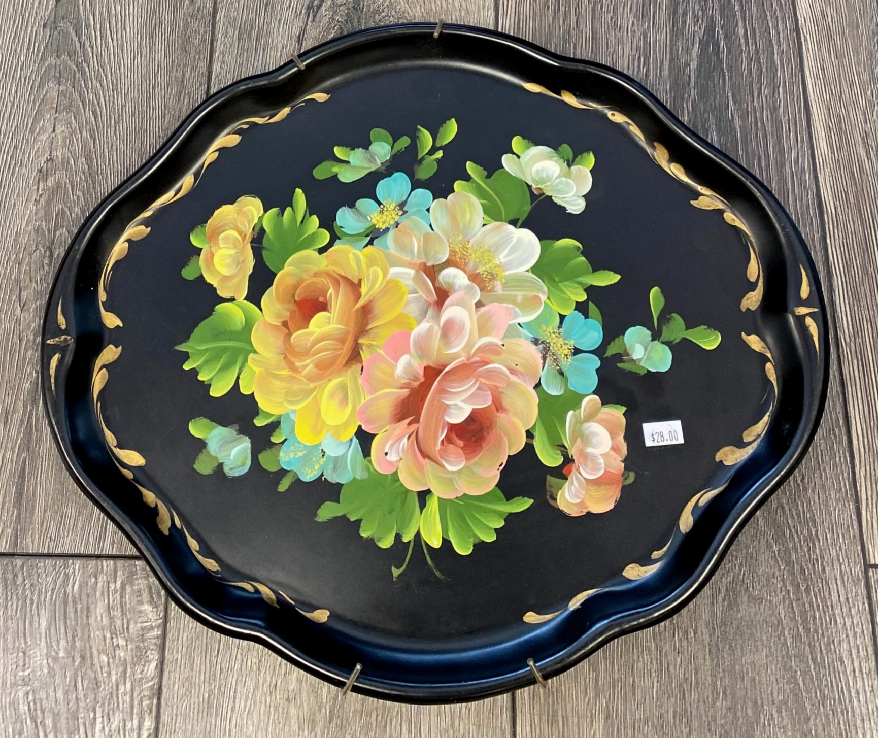 Black toleware tray with floral motif