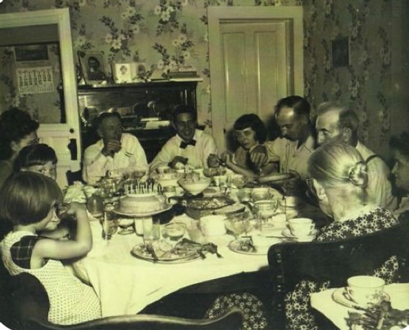 Vintage photo of a family having dinner