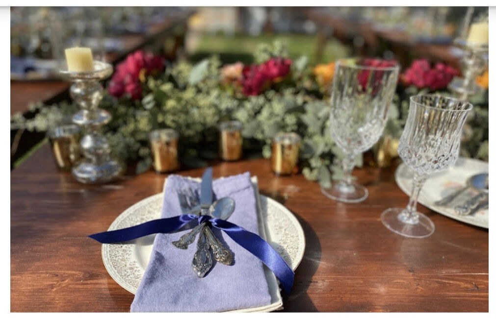 Silverware tied with a bow on a linen napkin