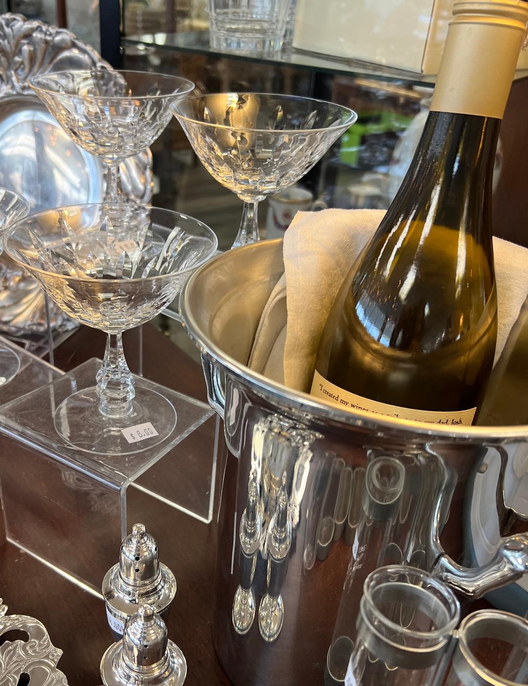 Dishfunctional store display with champagne bucket bottle and glasses