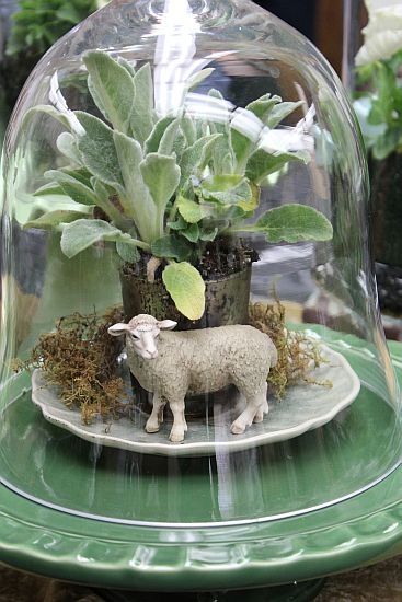 Vintage dish cloche with plant and lamb figurine