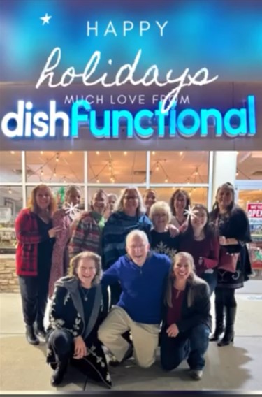 Group photo of the staff at Dishfunctional under the store sign