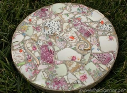 Mosaic garden stone made from broken dishes