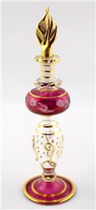 Cranberry glass and gold perfume bottle