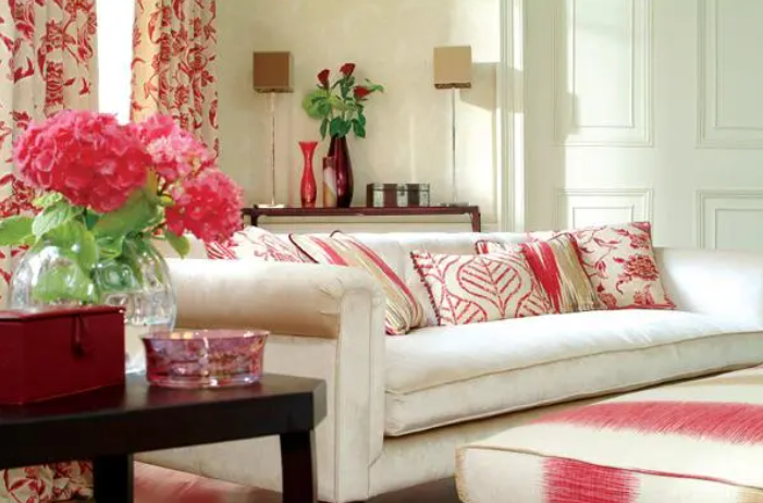 White living room with pink and red accents